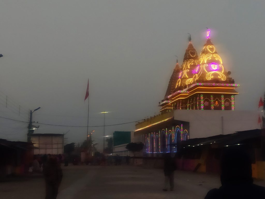 Kapil Muni Temple illuminated at dusk, Gangasagar